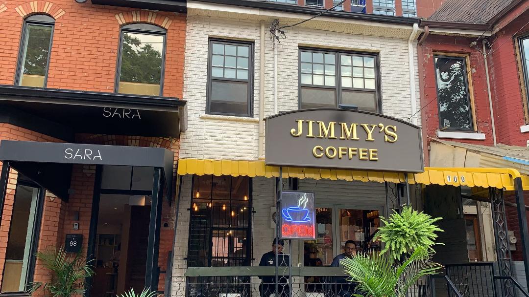 Jimmy's Coffee sign next to Sara's Restaurant in Toronto.