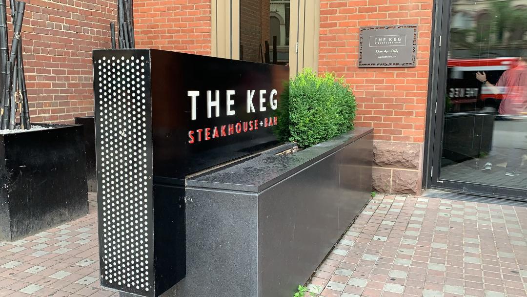 Large black and white sign for The Keg Steakhouse + Bar.