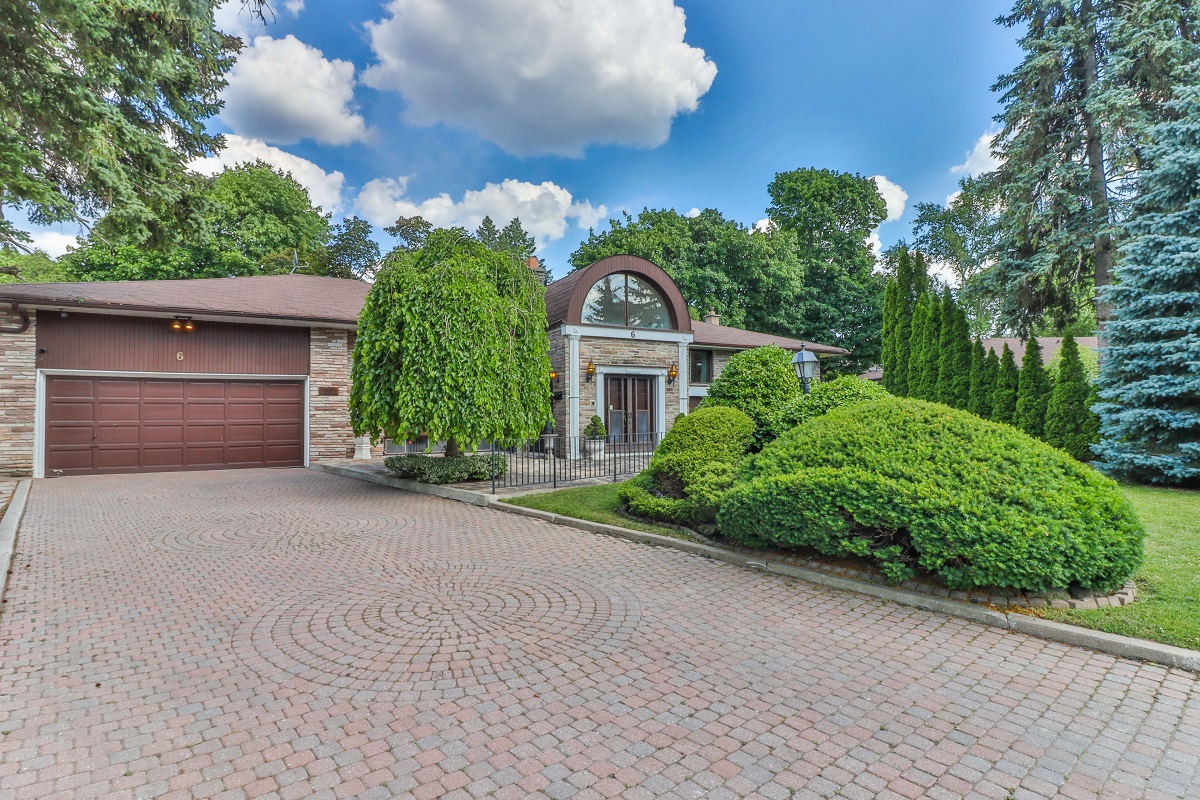 1-storey house with big driveway.