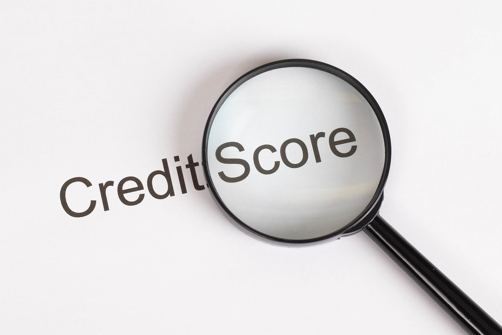 Magnifying glass enlarging words "Credit Score."