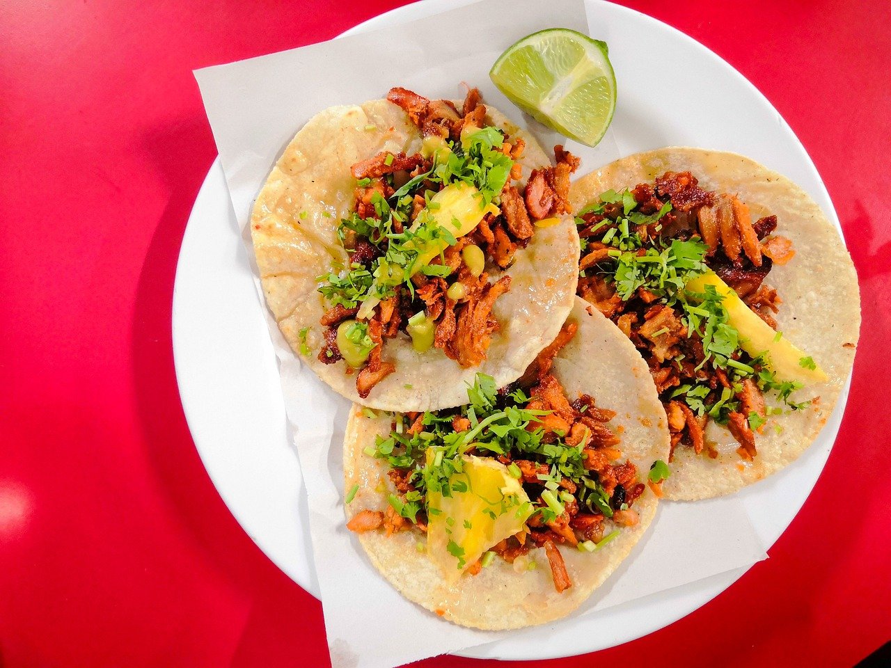 Tacos on white plate in King West Mexican restaurant.