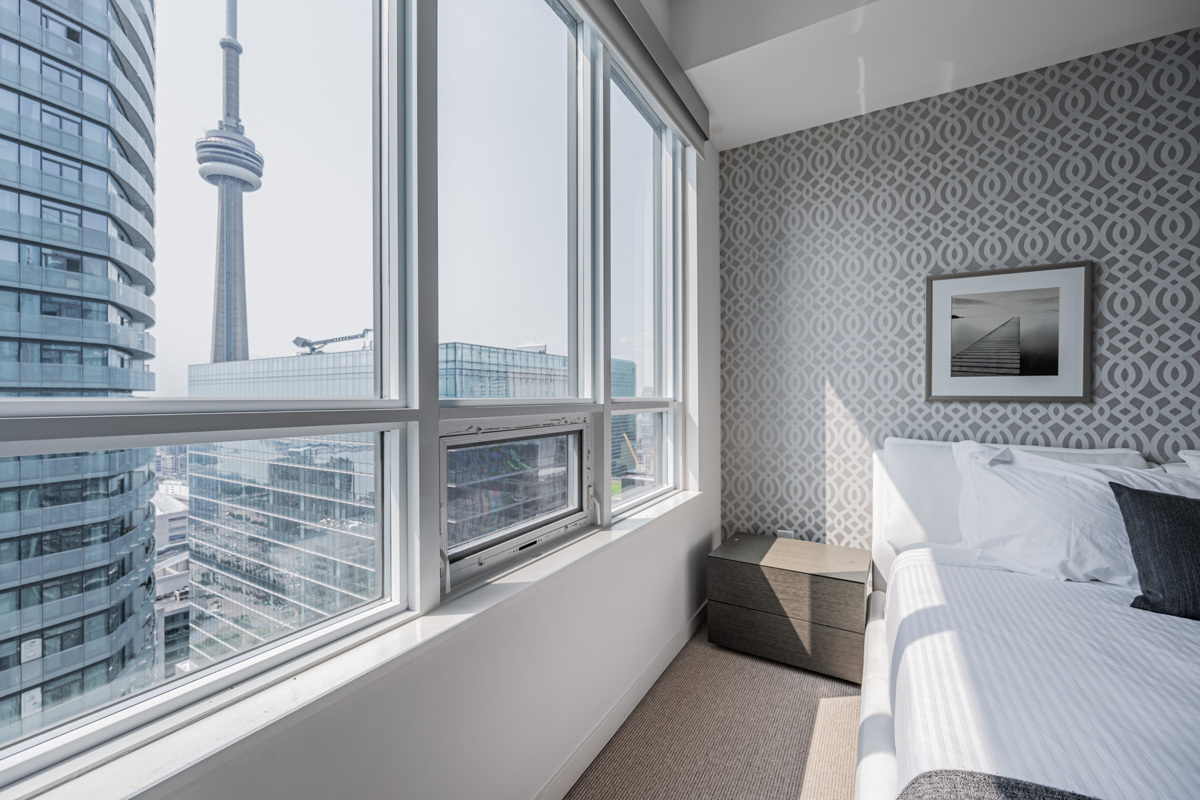 Close up view of CN Tower through bedroom windows.