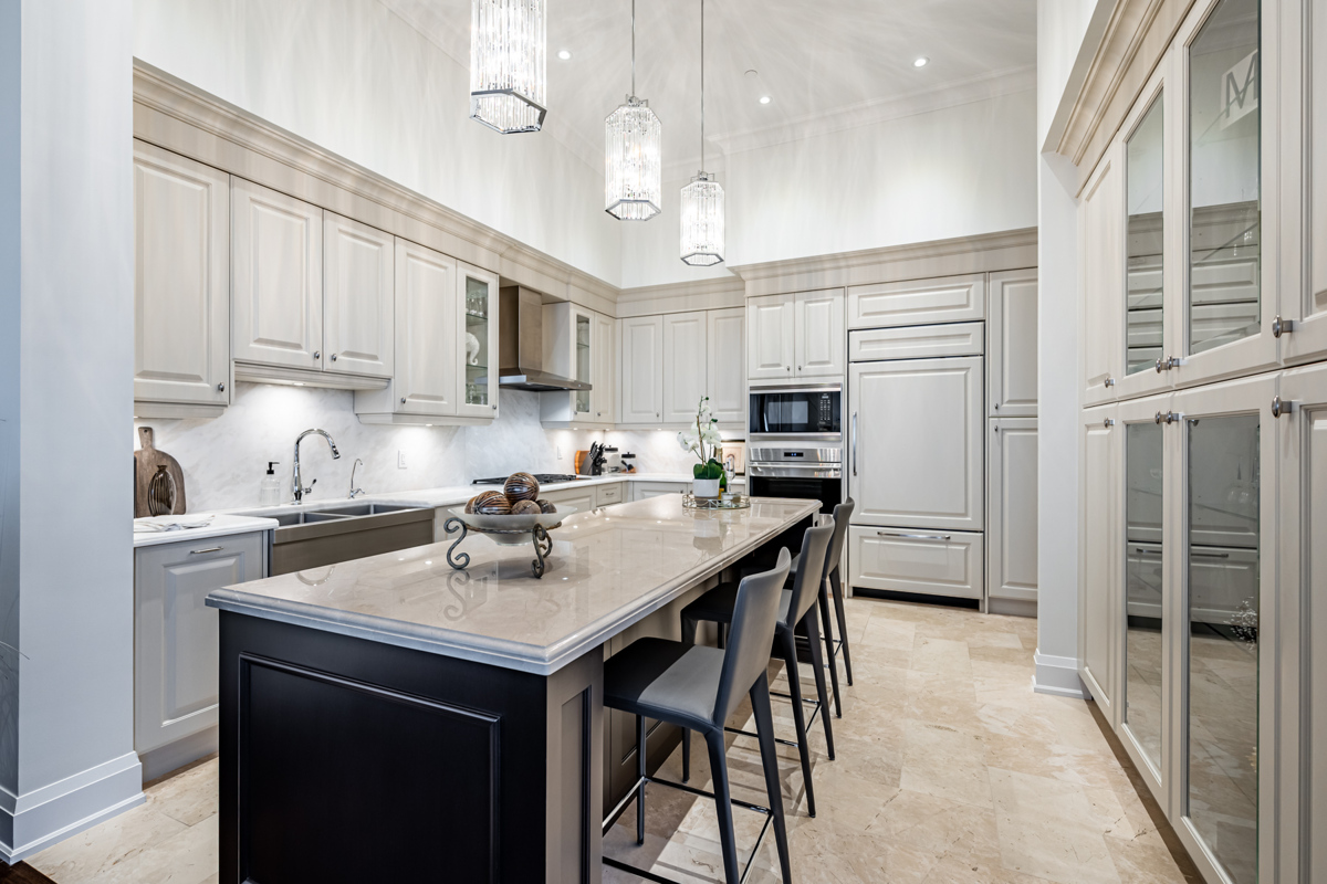 Penthouse kitchen with several cabinets, drawers and cupboards.