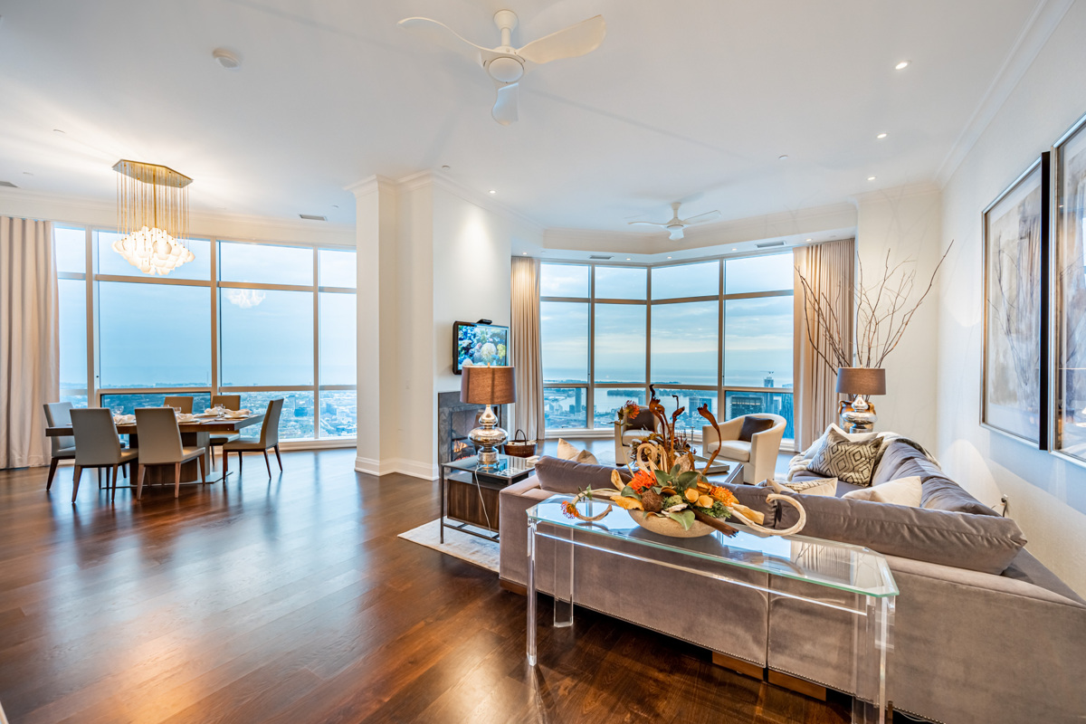 Large living and dining room of upscale Toronto penthouse.