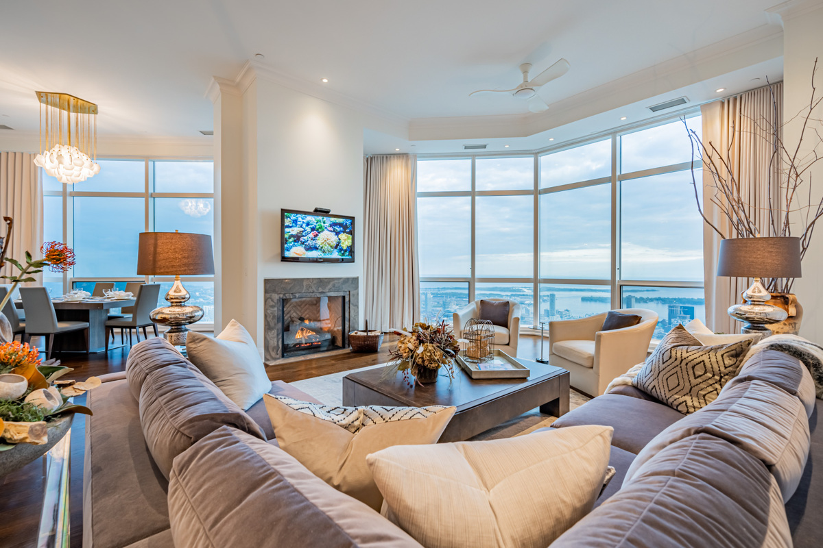 Condo penthouse with semi-circle windows showing Toronto.