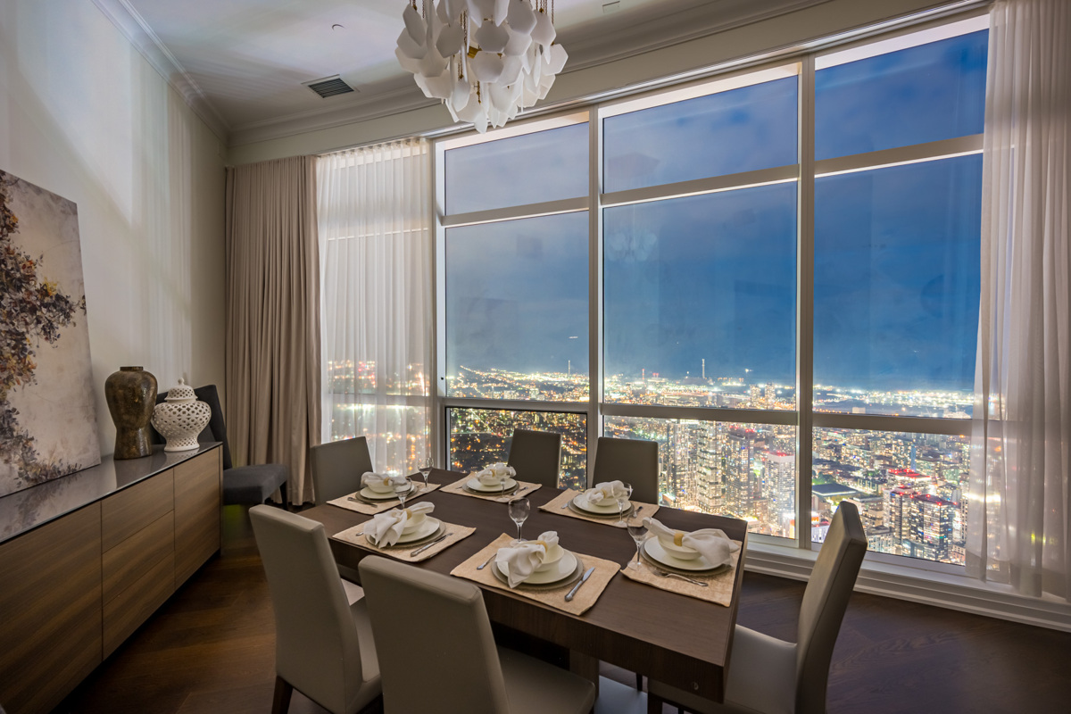 Night view of Toronto through penthouse windows.