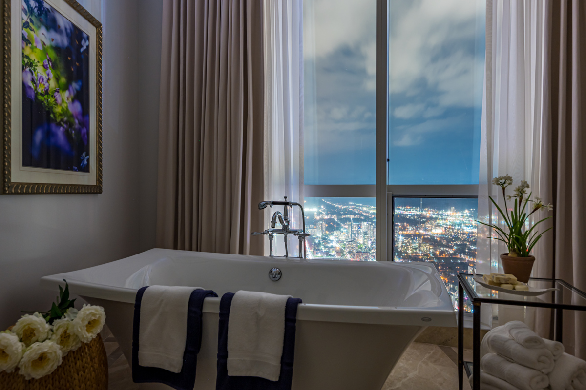 388 Yonge St ensuite bath with freestanding soaker tub at night.