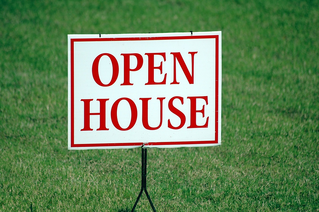 Open house sign on lawn. So this illustrates how not every property sells just because there's an MLS listing. Hiring is also important.