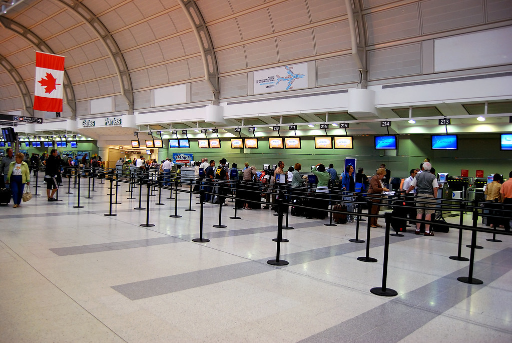 People in line at airport terminal - Pearson International Airport Toronto