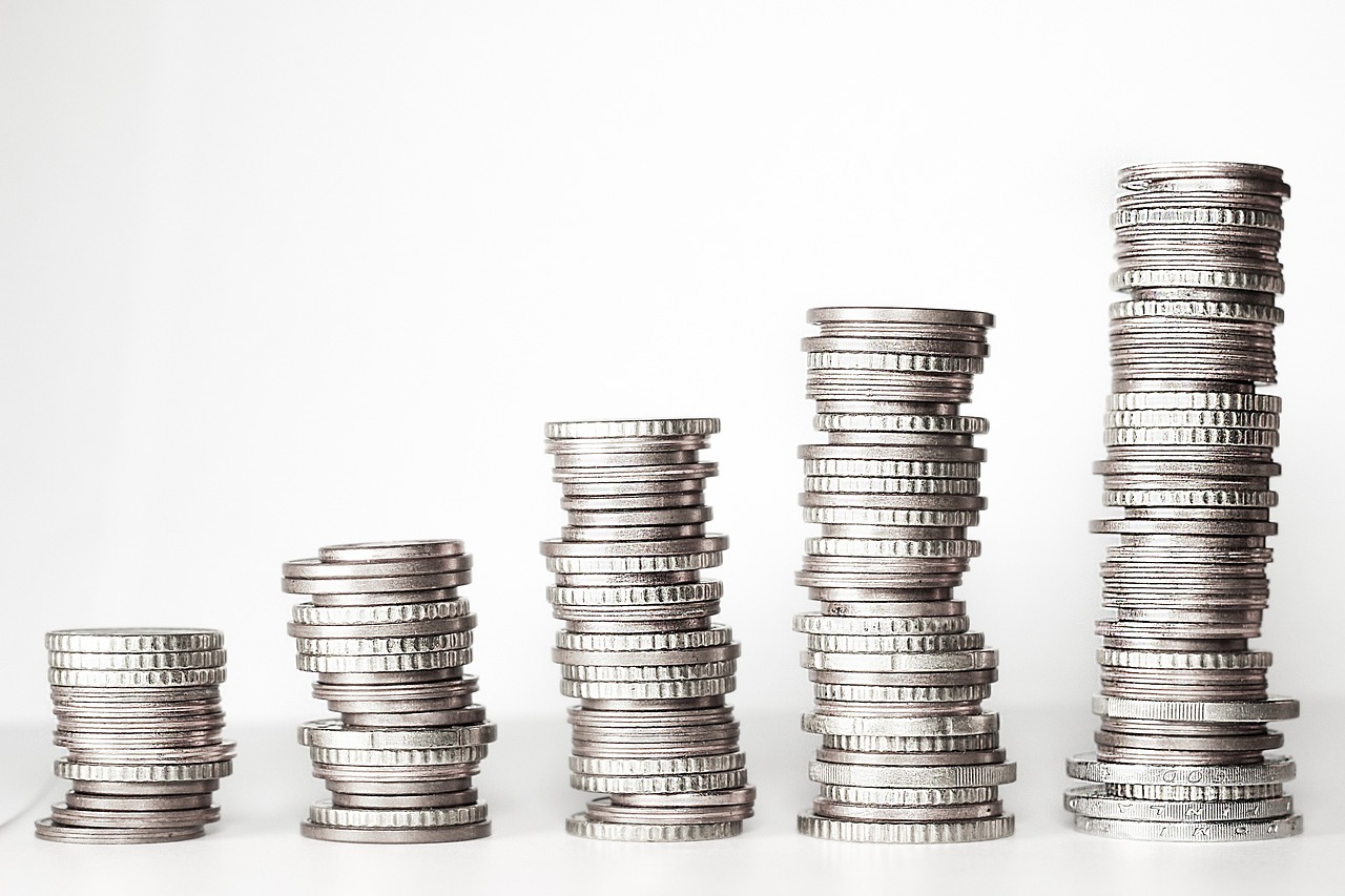 Various piles of silver coins.