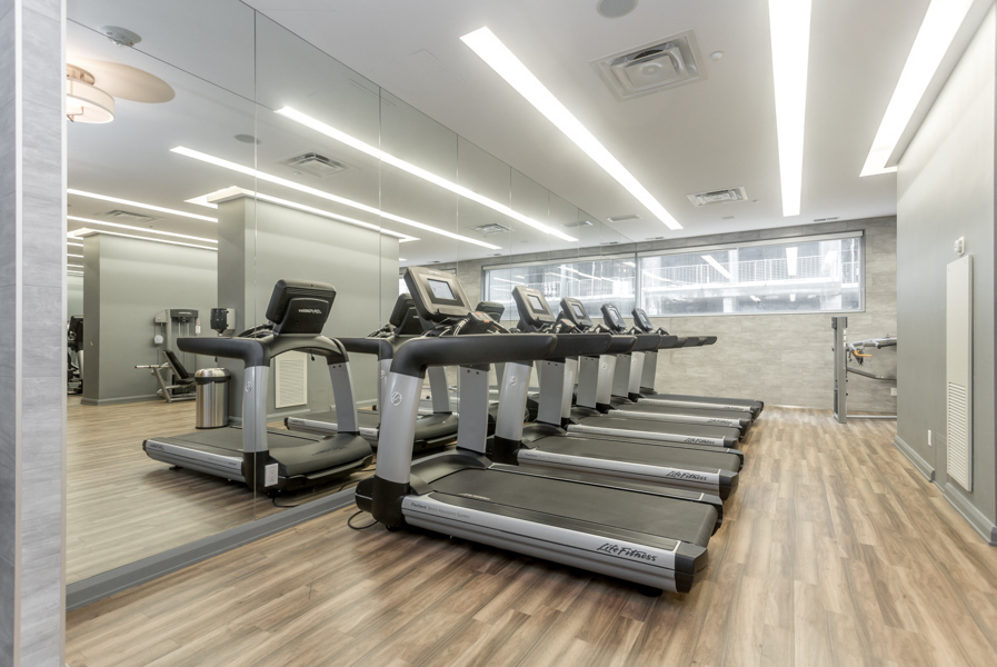 Gym with treadmills at Residences of Yorkville Plaza.