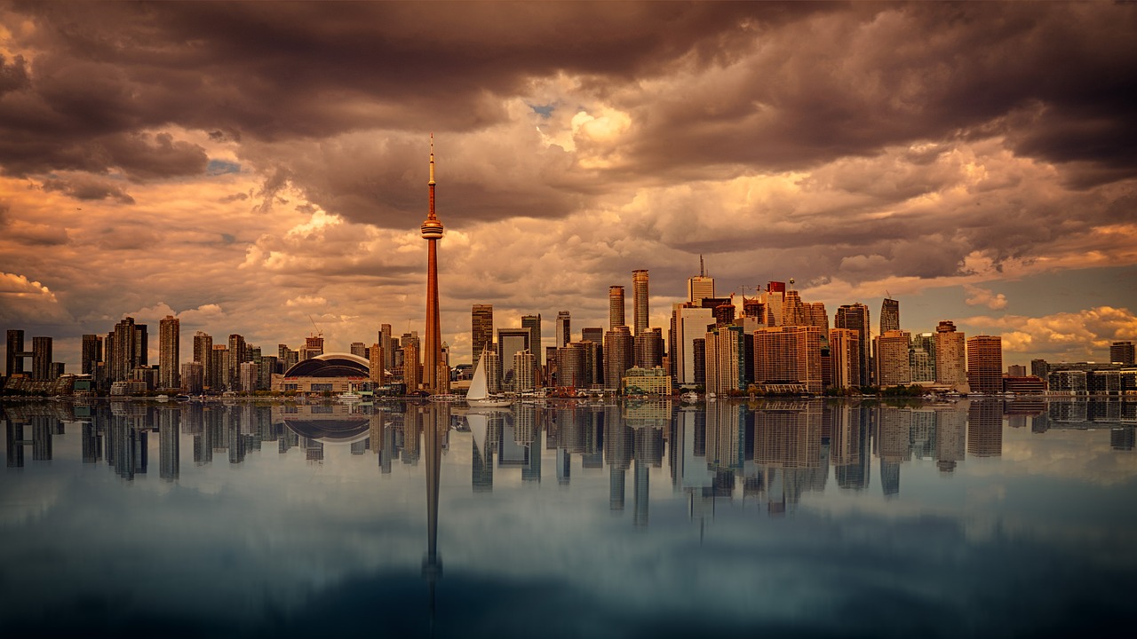 Stormy Toronto skyline at dusk seen from Lake Ontario.