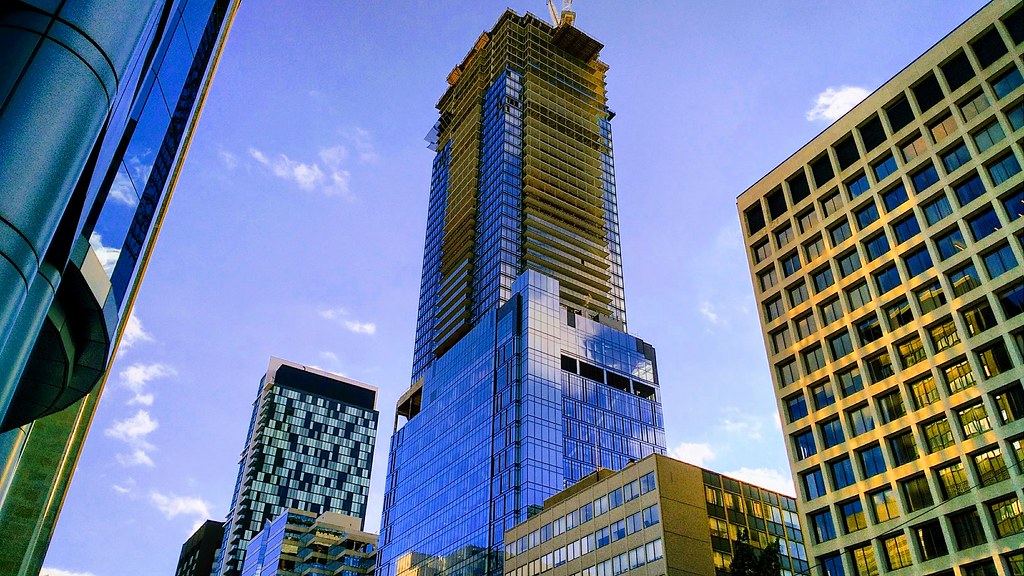 Toronto pre-construction property building with blue glass.