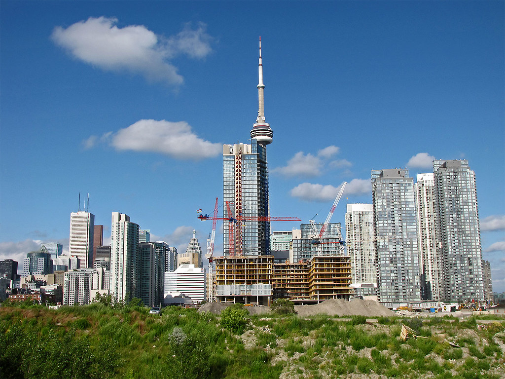 Toronto skyline with cn tower and condo pre-construction.
