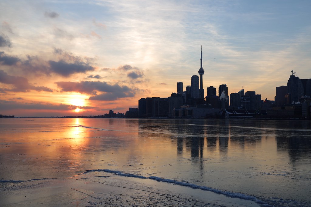 Winter sunset over Toronto's Lake Ontario and CN Tower.