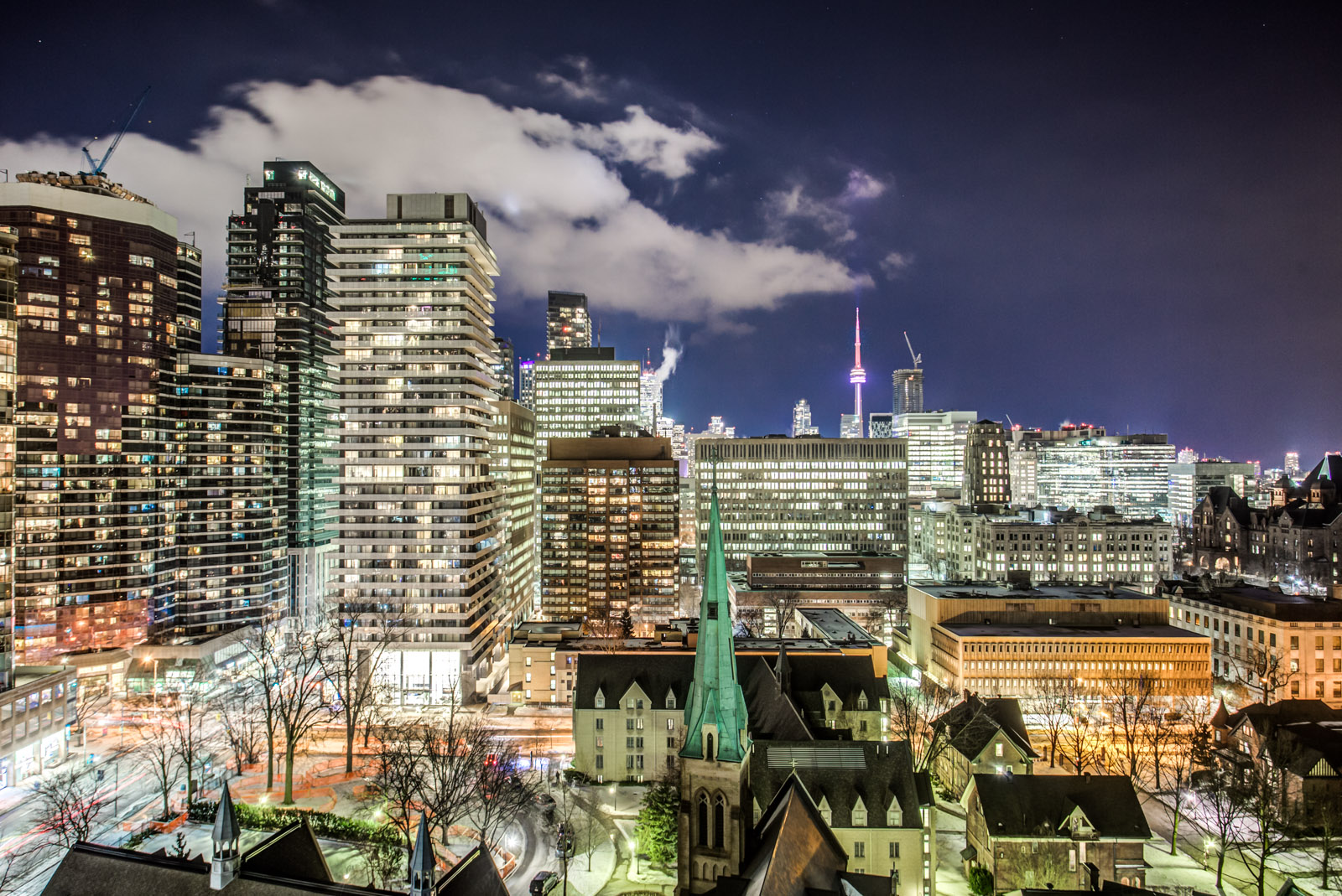 Night view of Toronto skyline from balcony of 5 St Mary St at U Condominiums.