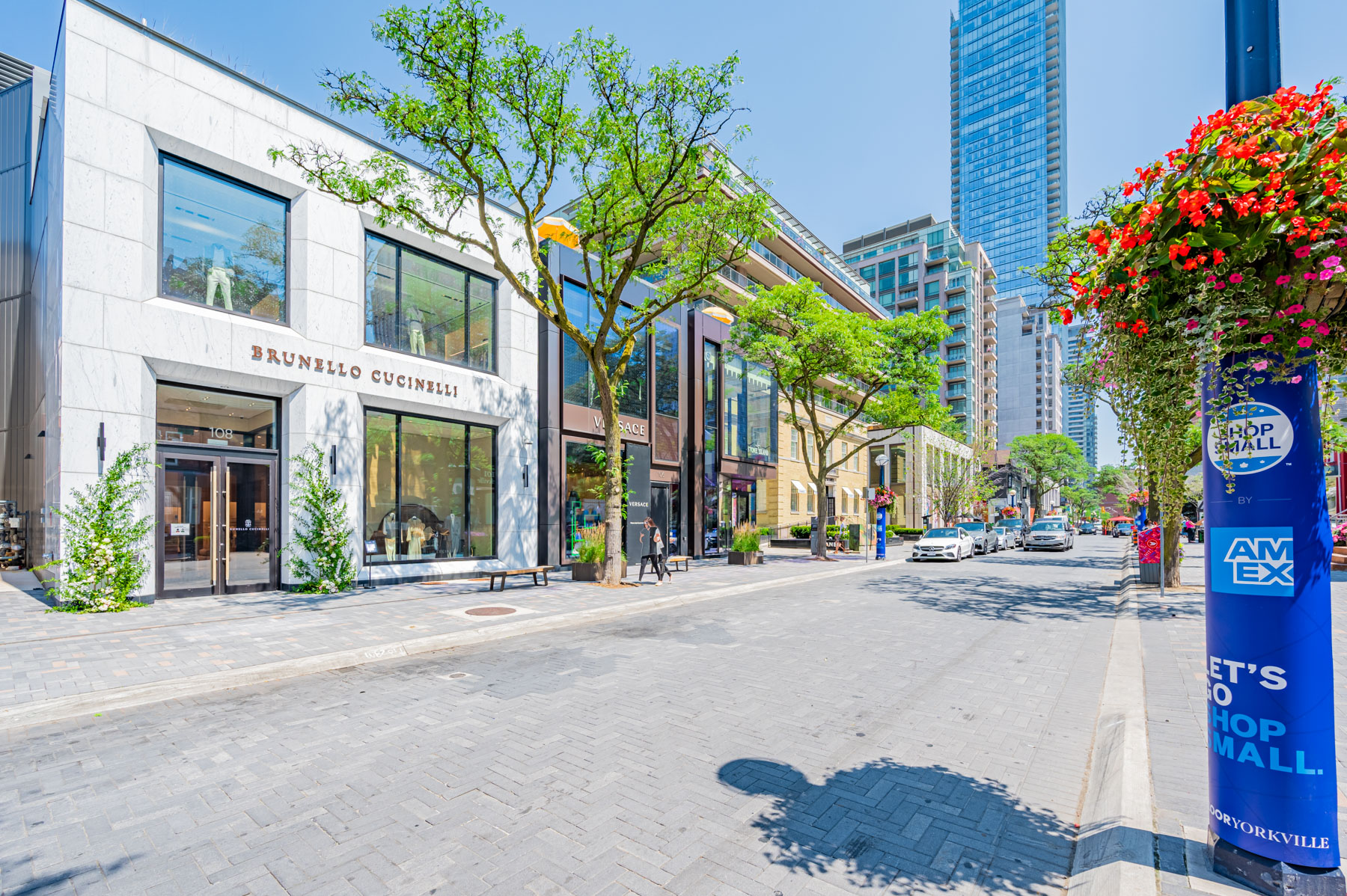 Brunello Cucinelli and Versace flagship storefronts in Yorkville, Toronto.