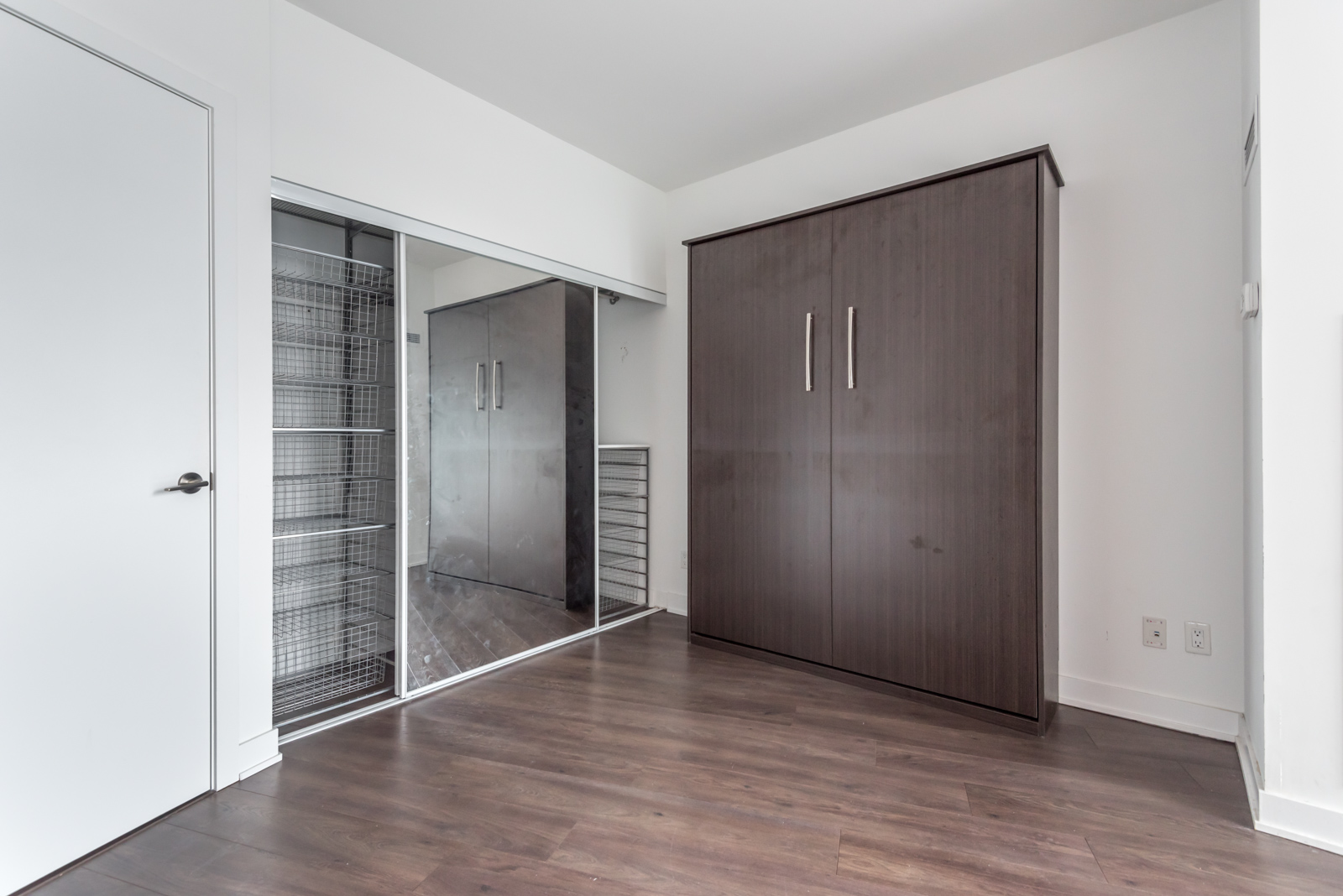 Photo showing closet with Murphy Bed tucked inside.