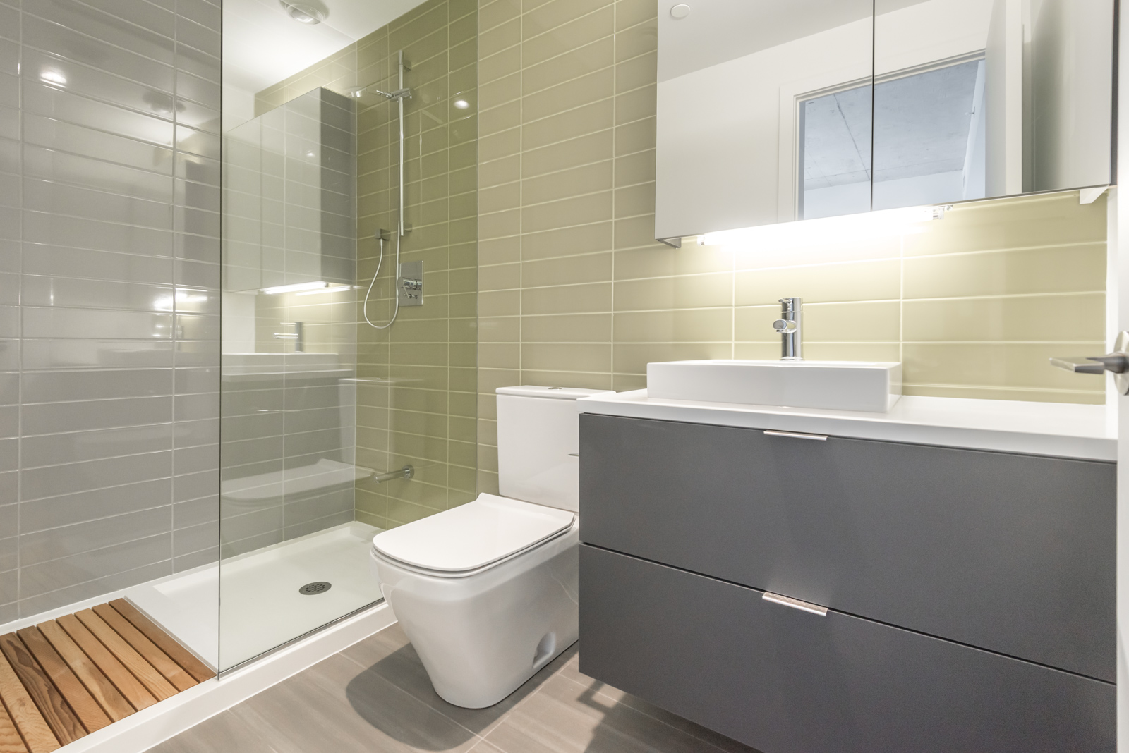 Another bathroom pic, and this one is of second bathroom. It's less in size, but it's rather beautiful with its use of wood and colour. Also, the layout is rather striking.