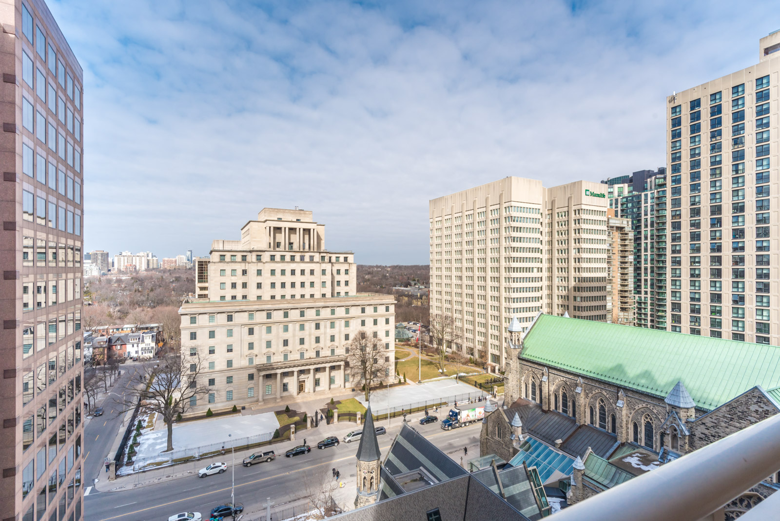 Photo from balcony shows Toronto and so much of the streets below.