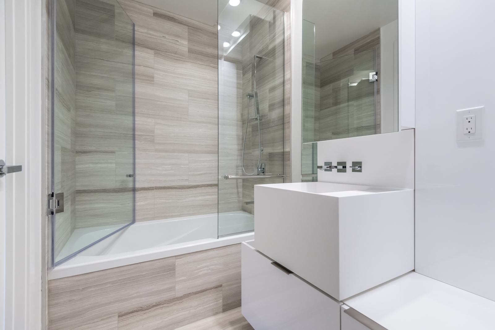 Photo showing 1 Bloor master bathroom. So we see the tub, sink, and shower.