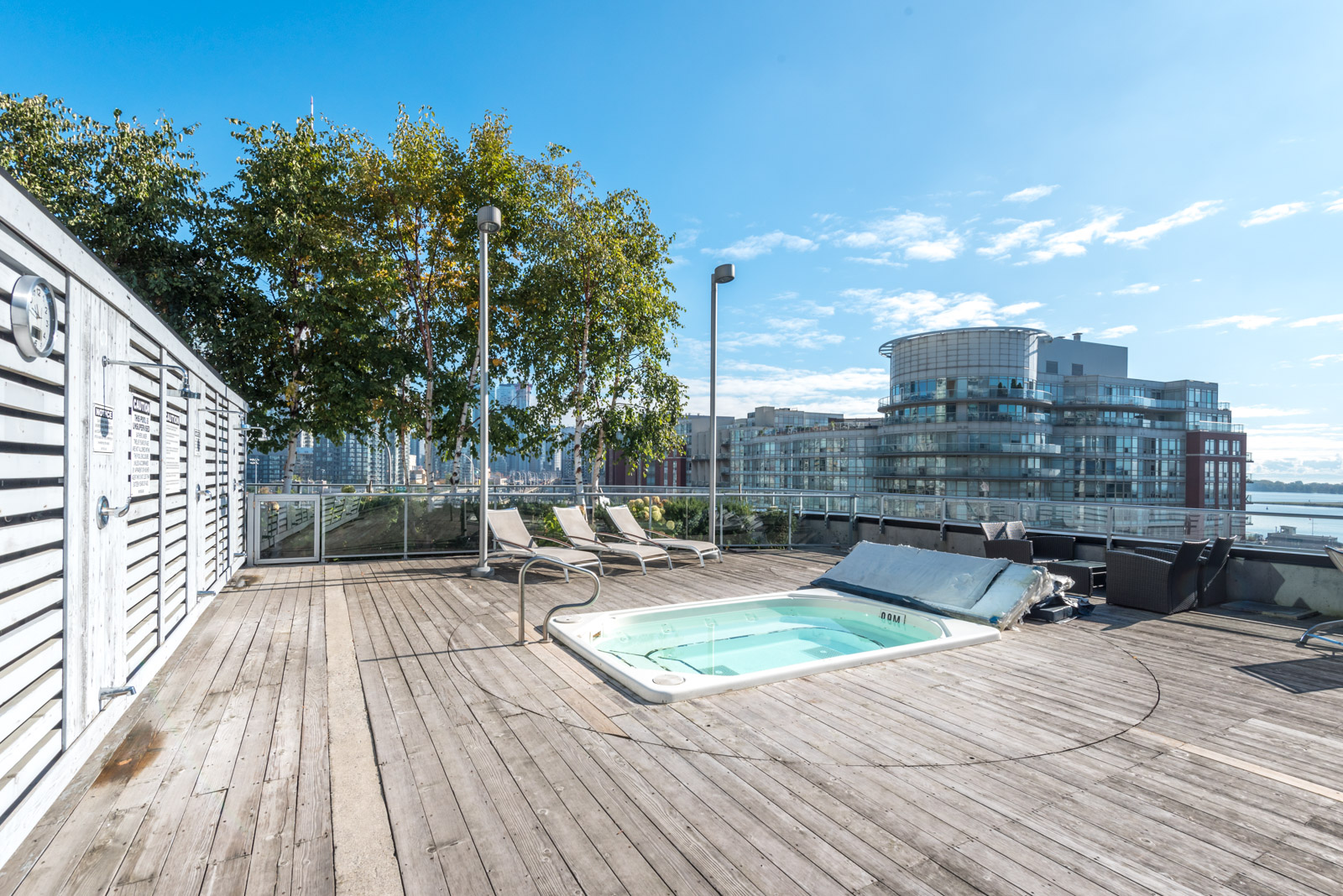 Picture of condo's roof and also hot-tub and chairs.