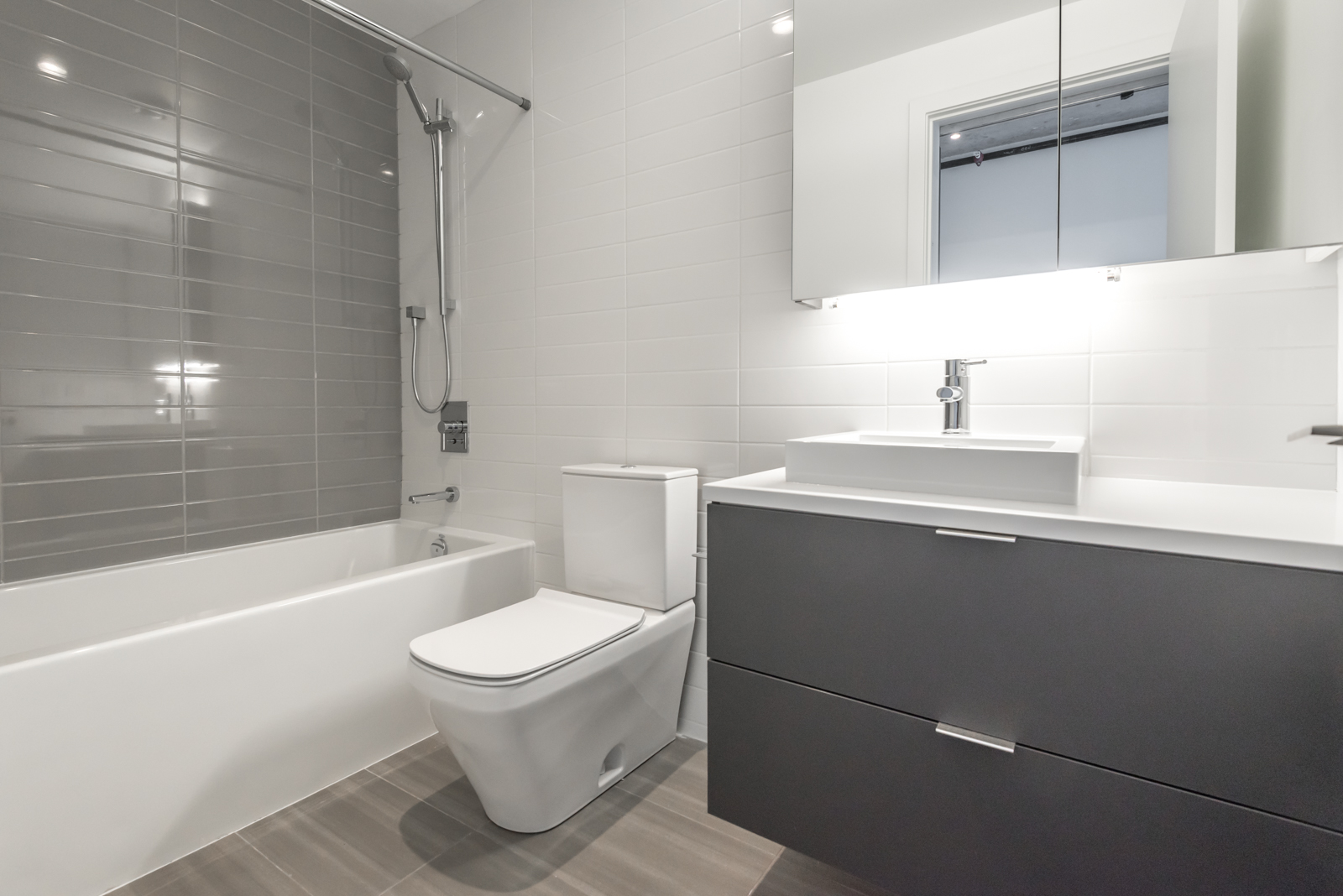 Lovely photo of master bath and tub, sink, and more.