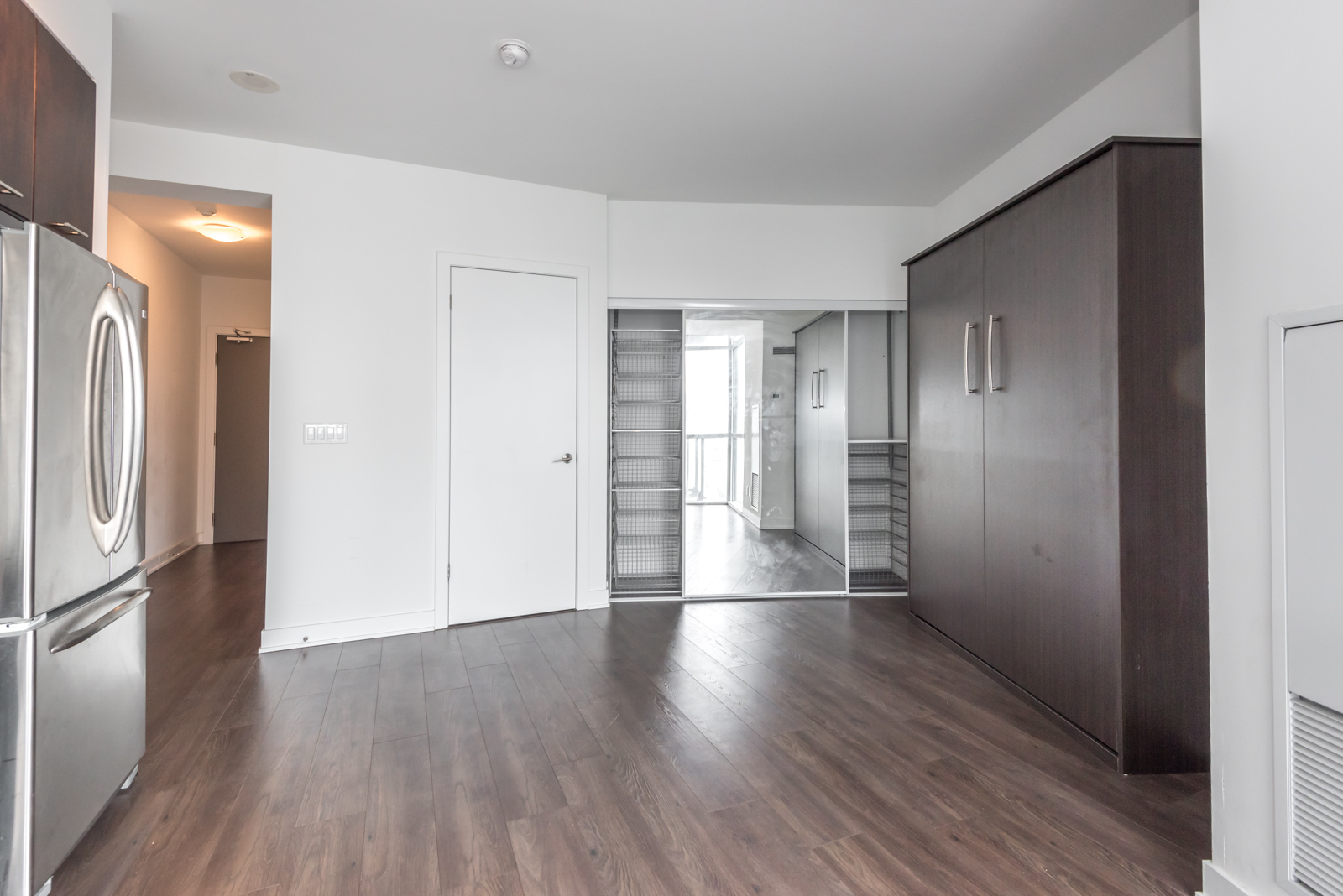 Pic showing 169 Fort York closet. Because of baskets, there's plenty of space.