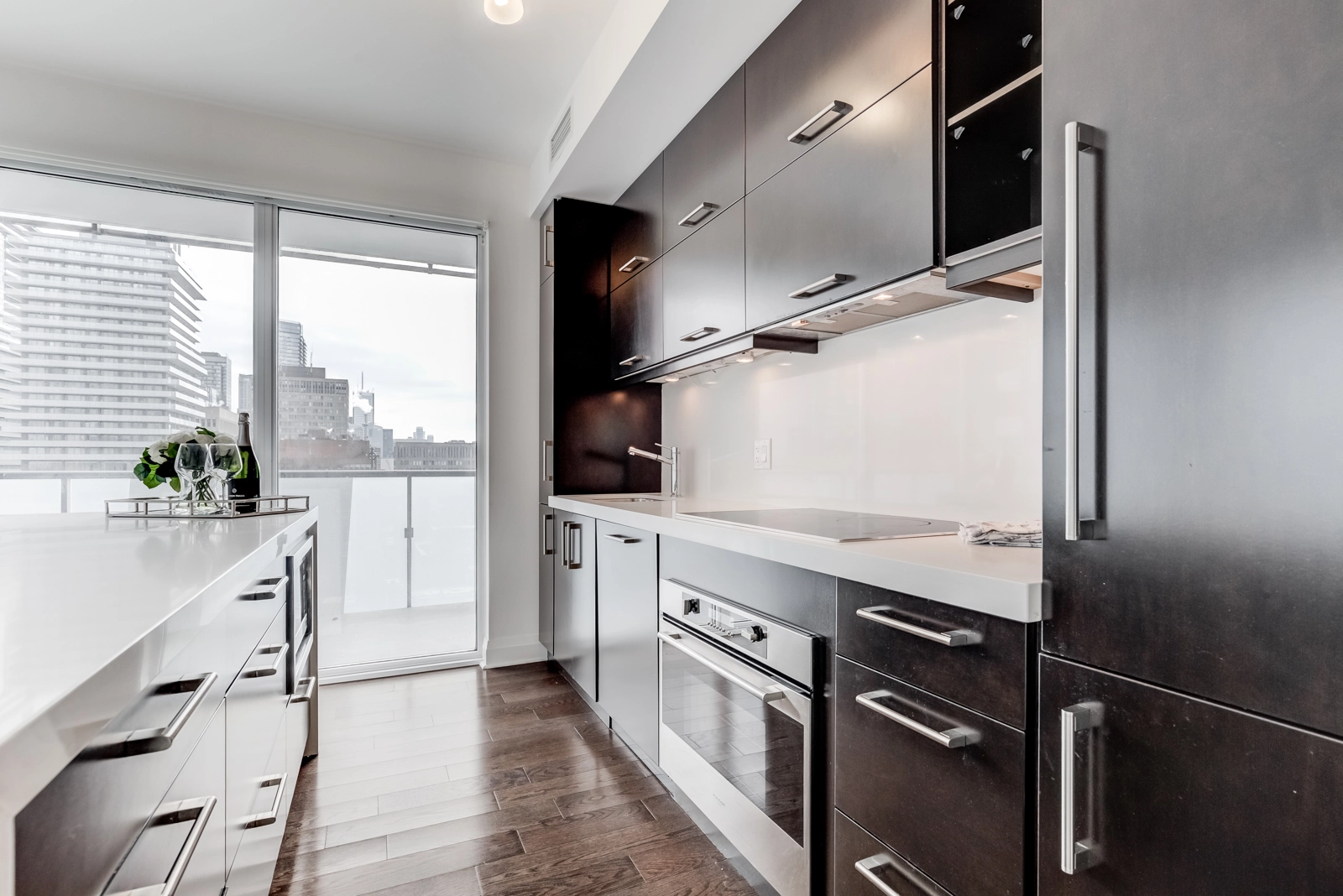Photo of 100 Hayden Street living room and kitchen. And first of all, also, another, furthermore, finally, in addition because, so, due to, while, since, and therefore.