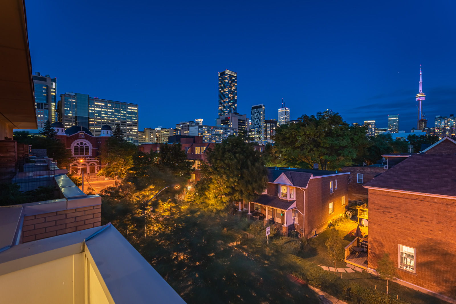 night view of Toronto skyline and CN Tower from suburbs