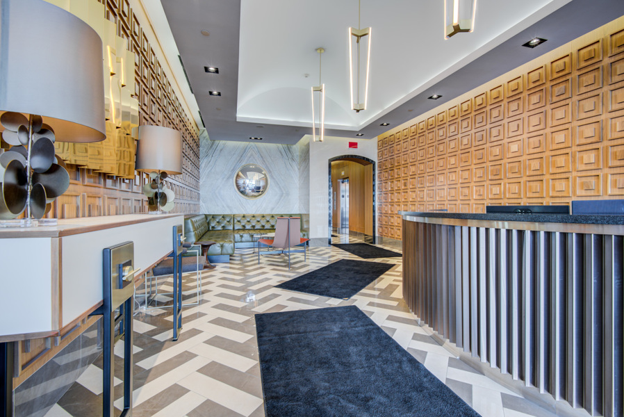 Lobby of The Hill Condos with modern lighting, furniture and decor.