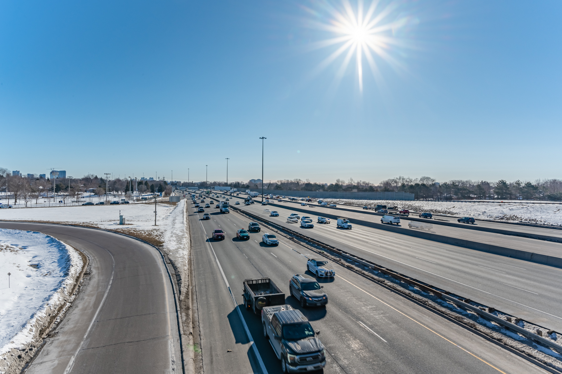 View of multi-lane highway and vehicles.