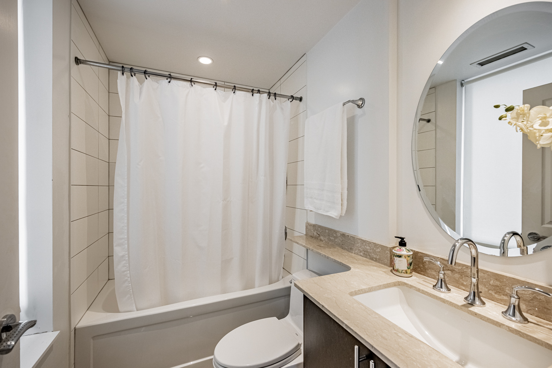 Ensuite bathroom with granite counter, potlights and soaker tub.