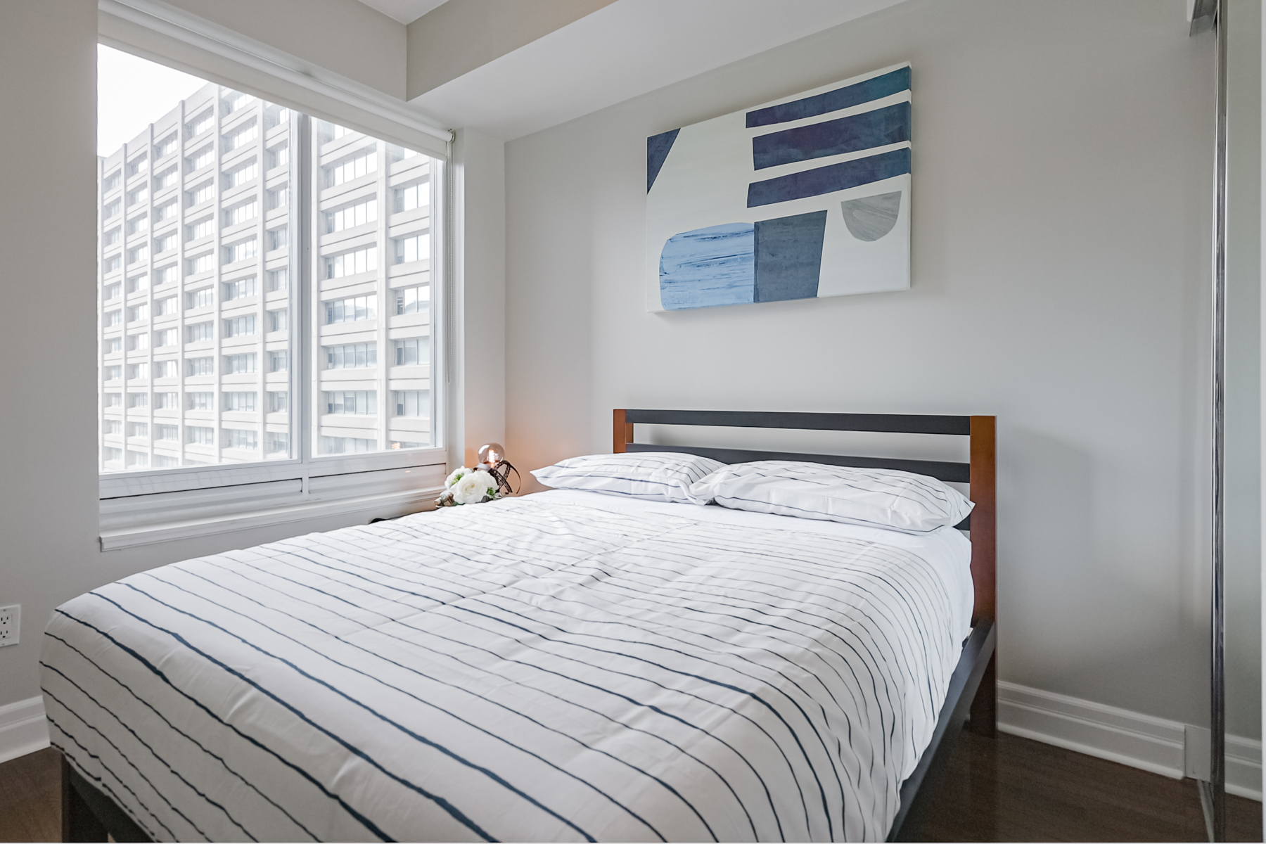 35 Balmuto St Unit 1209 – secondary bedroom with bed and window.