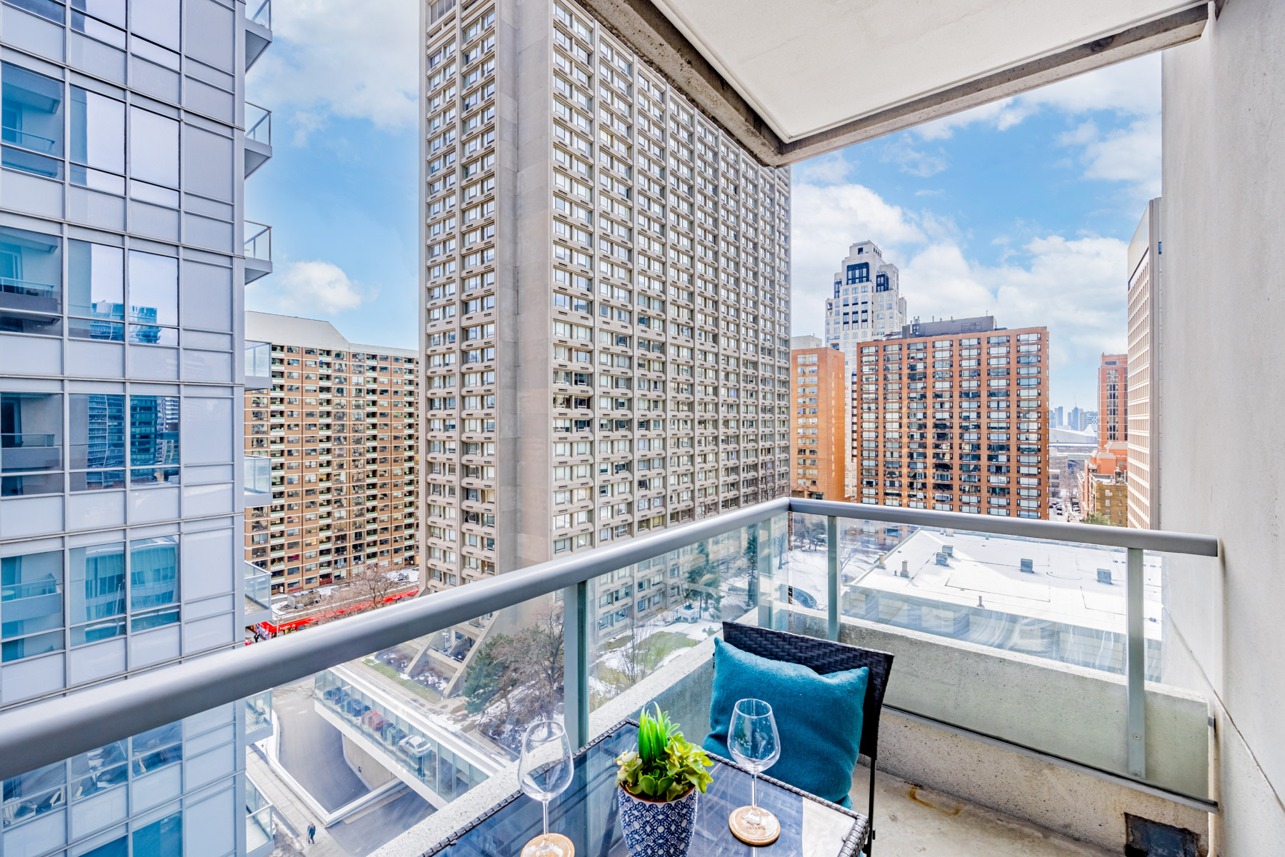 View of Toronto buildings from balcony of 35 Balmuto St Unit 1209.