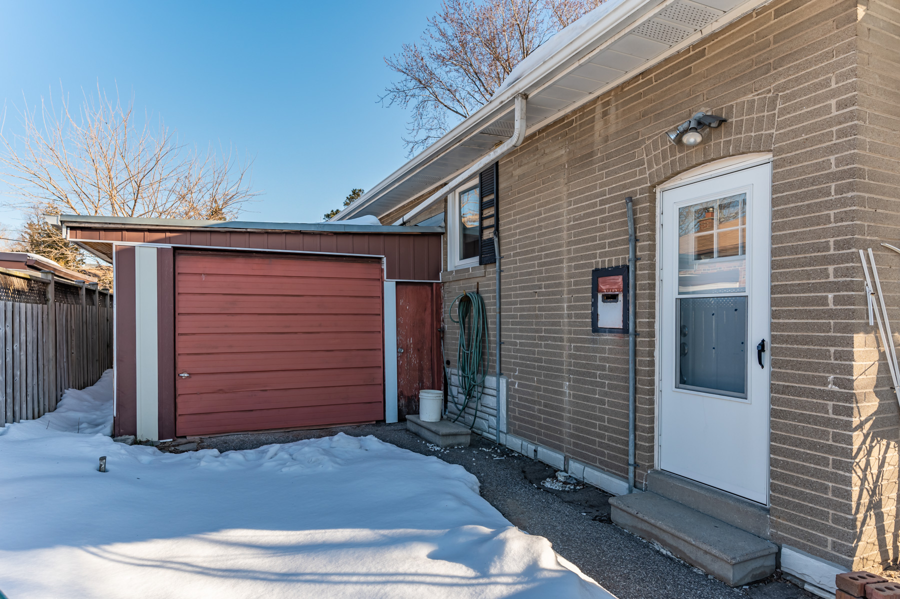 Entrance of 6 Wishing Well Dr basement next to garage.