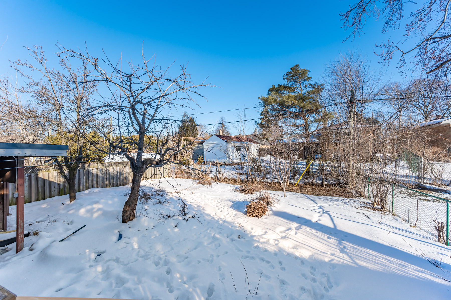 6 Wishing Well Drive's large snow-covered backyard.