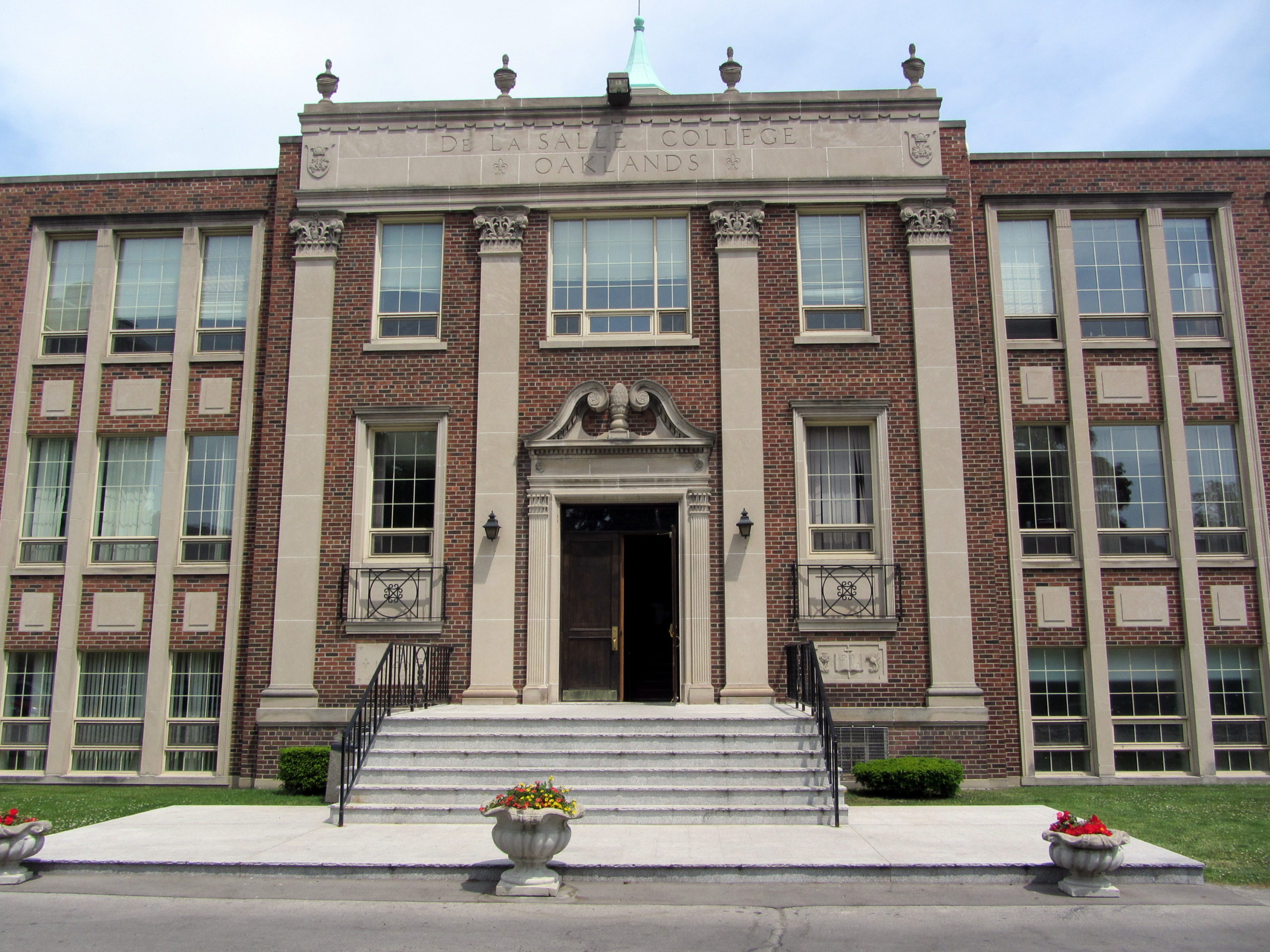 Brown-brick exterior of De Sale College in Yonge and St. Clair.