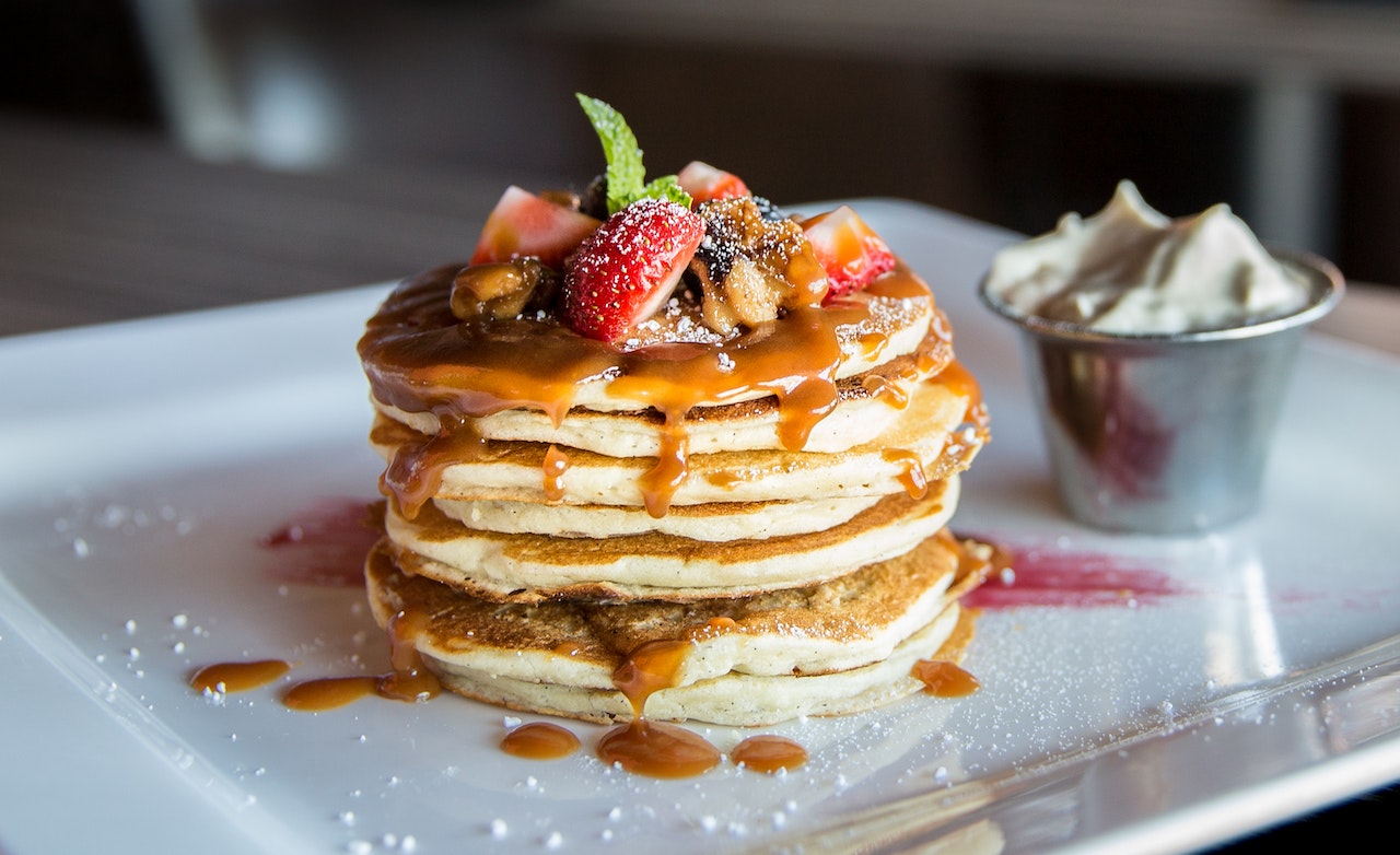 Plate of stacked pancakes to show dining options in Yonge and St. Clair.