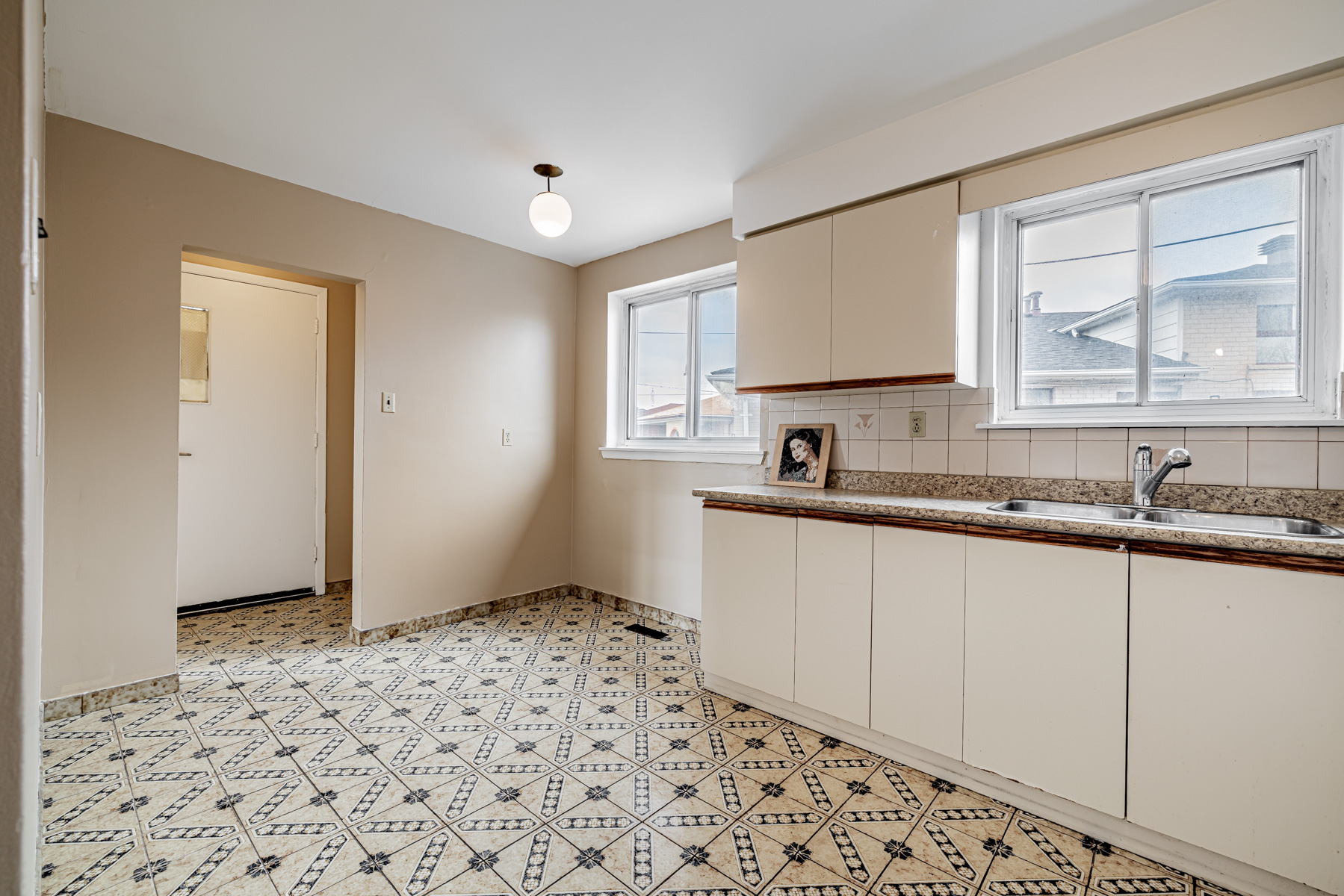 Large kitchen with space for dining table.