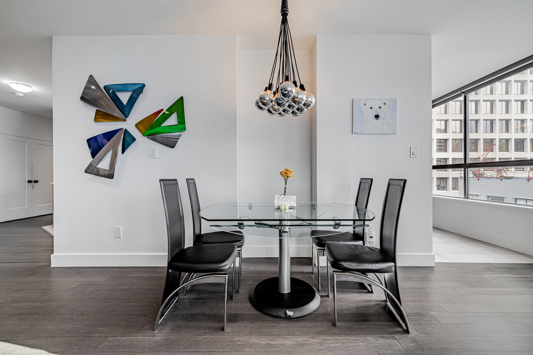 Pendant lights with silver spheres – 280 Simcoe St Ph-09 dining room.