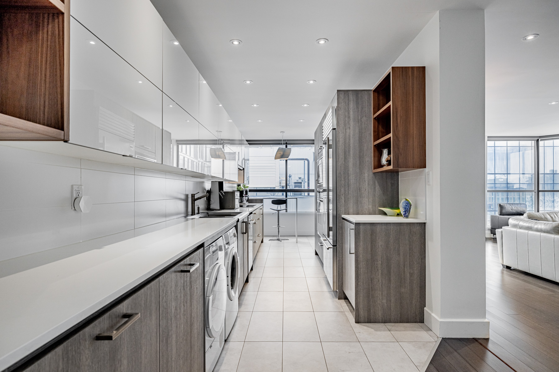 Long and narrow galley kitchen of 280 Simcoe St Ph-09 penthouse.