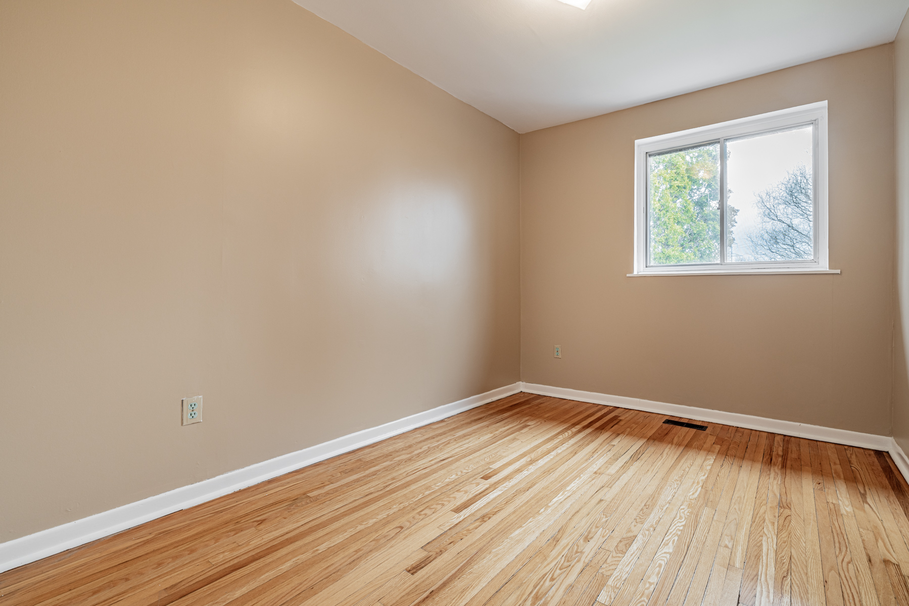 1 Stong Court -- 2nd bedroom with hardwood floors.