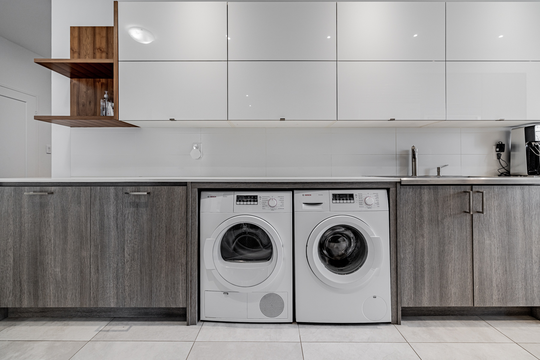 Galley kitchen with washer and dryer.