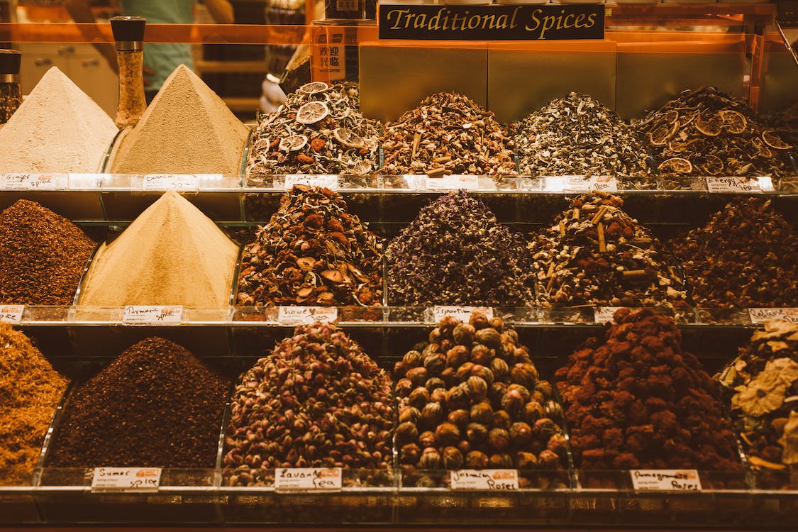 Heaps of neatly arranged spices in store.