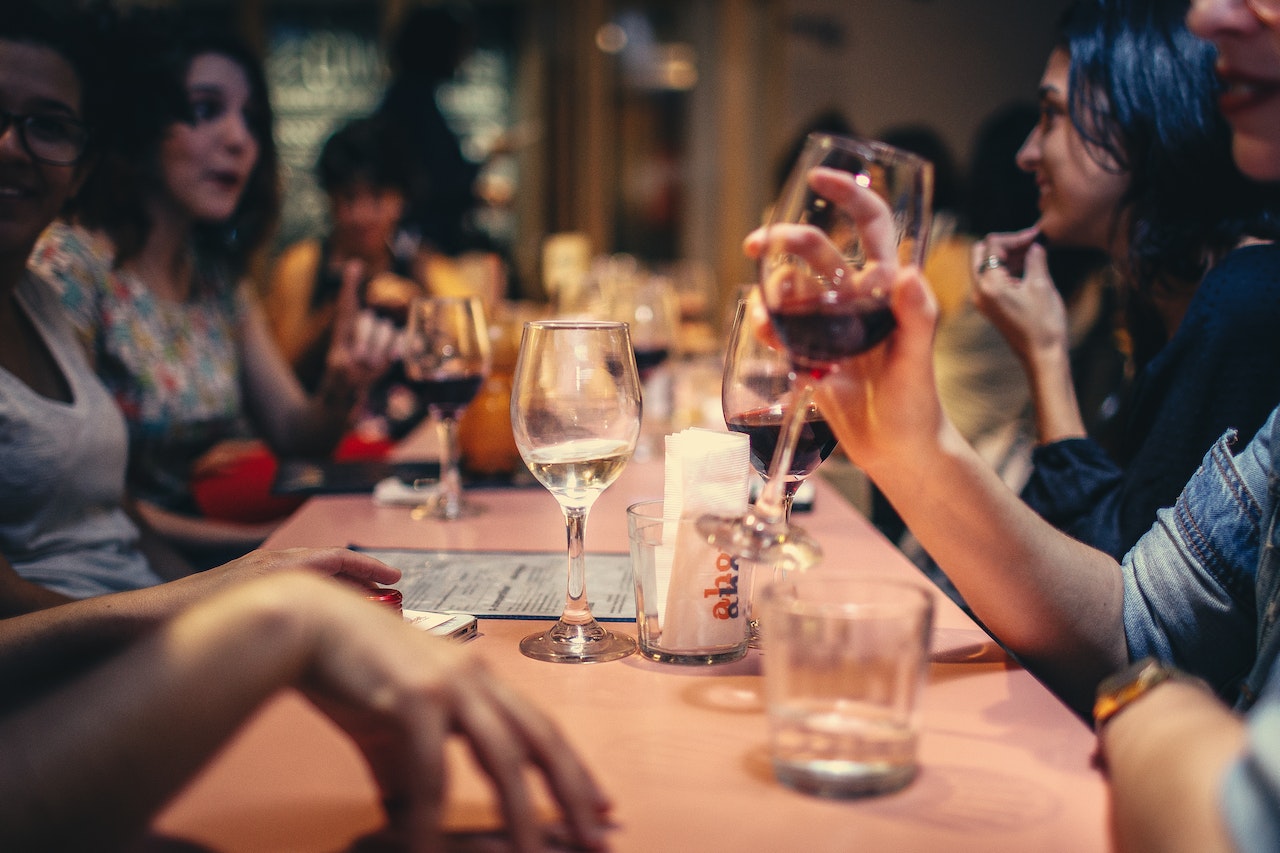 Young people drinking at bar.