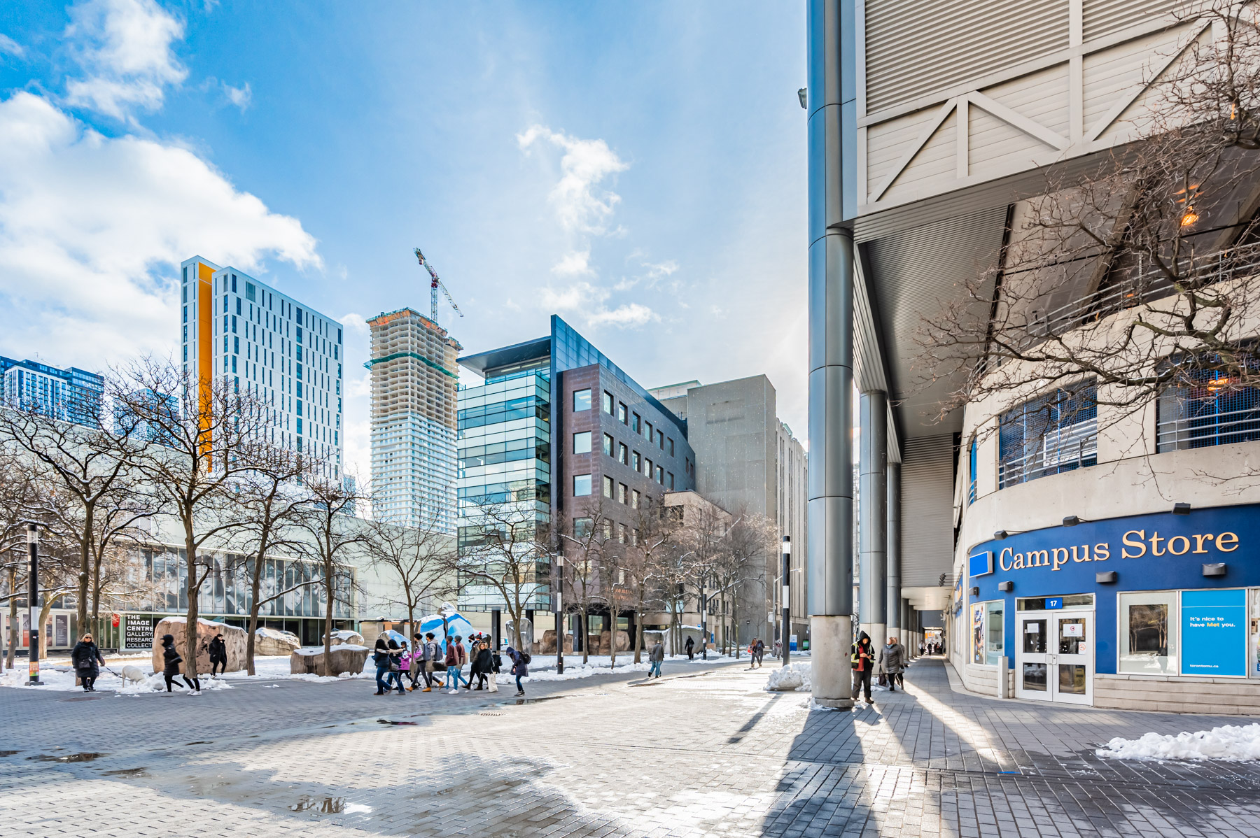 Students walking around Toronto Metropolitan University (TMU) in winter.