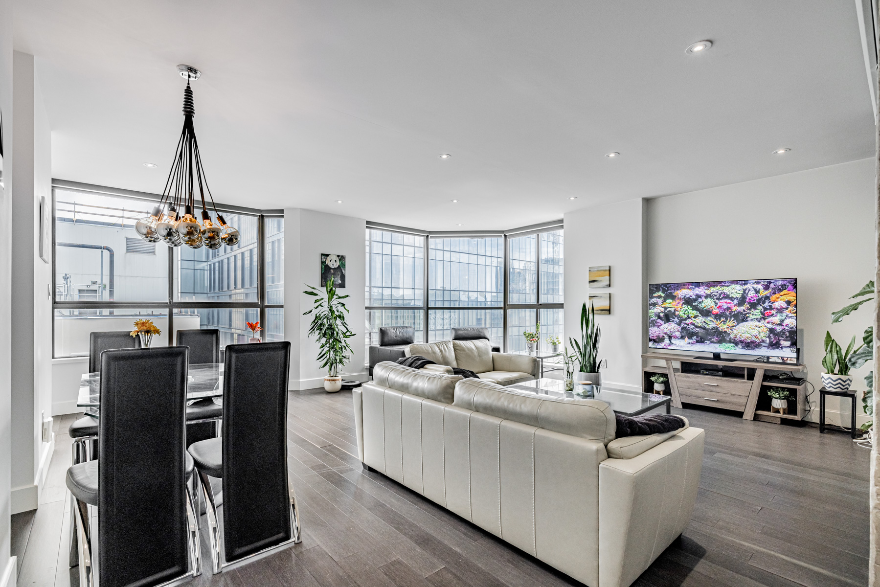 View of floor-to-ceiling penthouse windows from dining room.