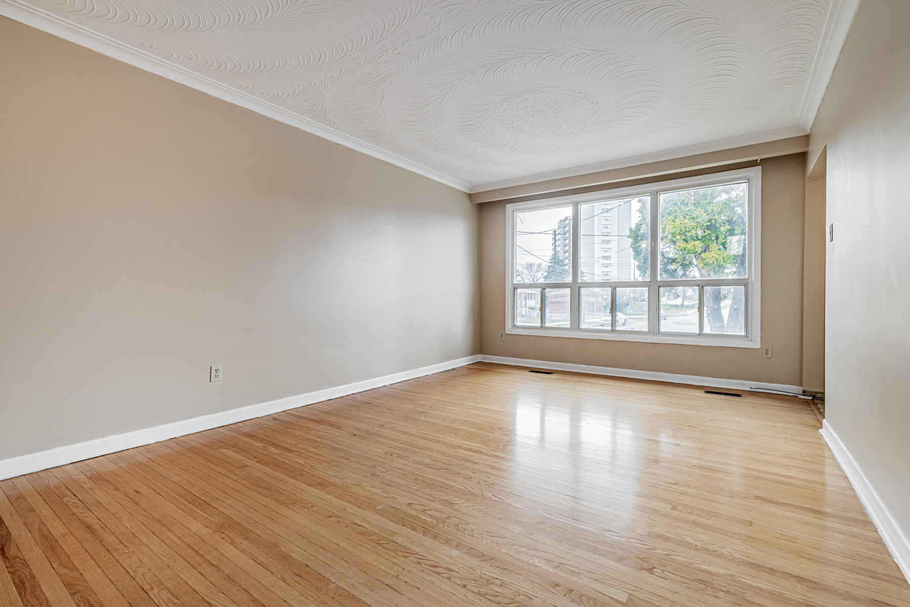 Shiny hardwood floors of living room.