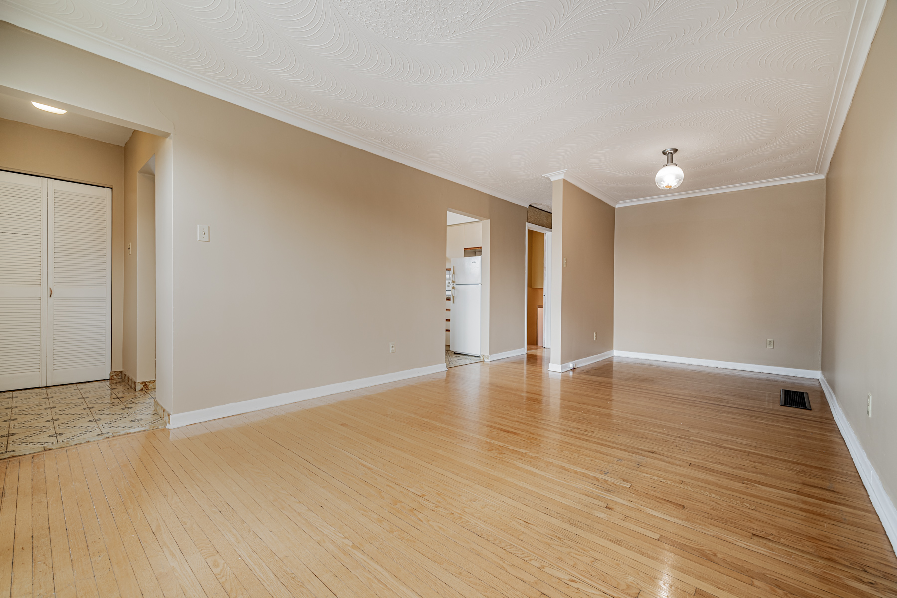 Large open-concept living and dining room of 1 Stong Court.